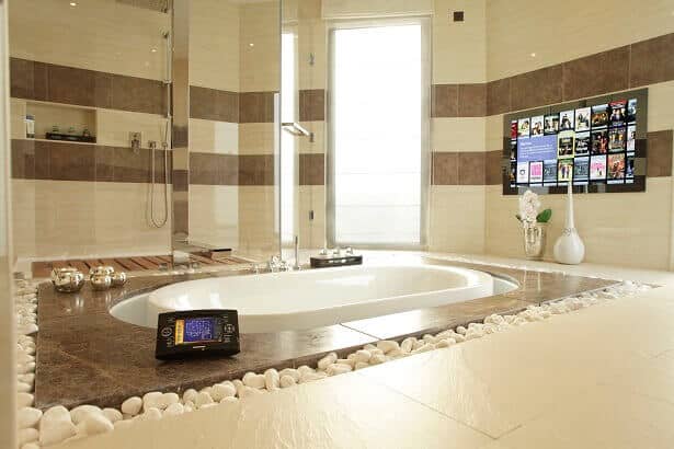 A Bathroom Mirror TV is controlled by a Crestron Touchpanel