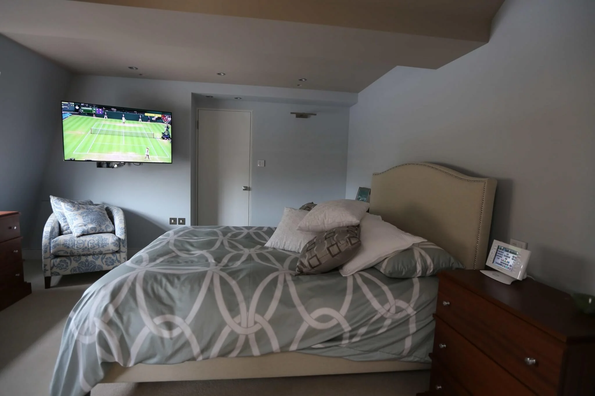 Floating television in a bedroom on a Crestron whole-home system, Belgravia townhouse, London