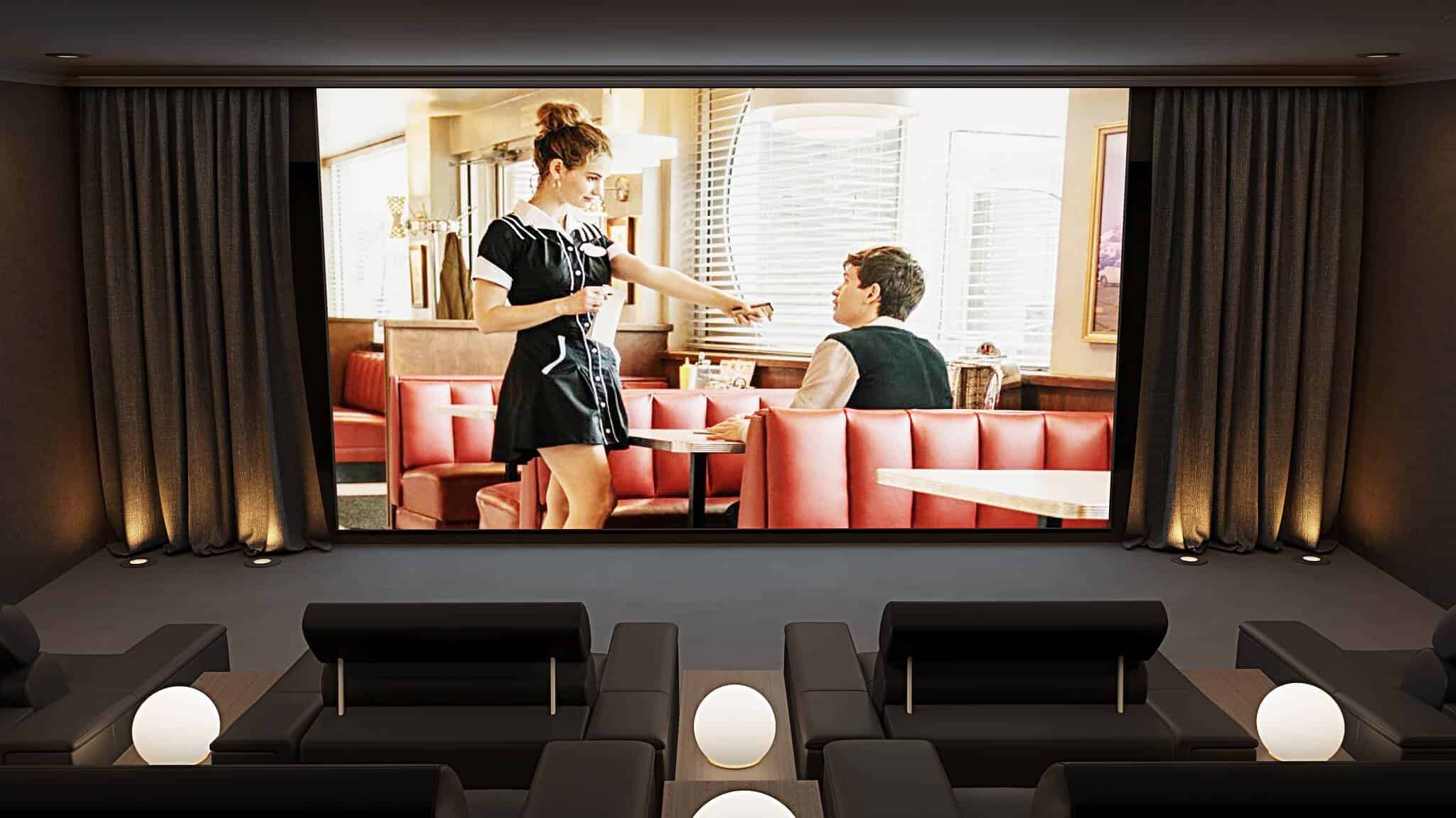 Professional home cinema room with large screen and Artcoustic speakers