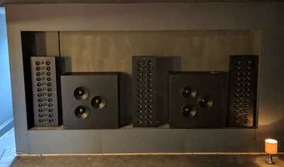 Artcoustic speakers installed in a recess behind the screen in the Surrey home cinema room
