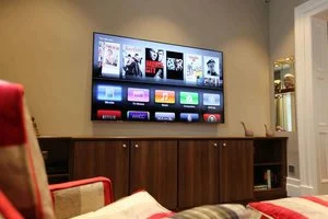 Living room home cinema in Belgravia, London, with plastered-in speakers